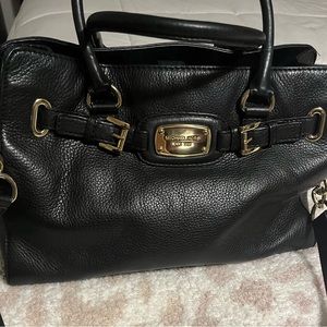 Michael Kors hand bag with strap.